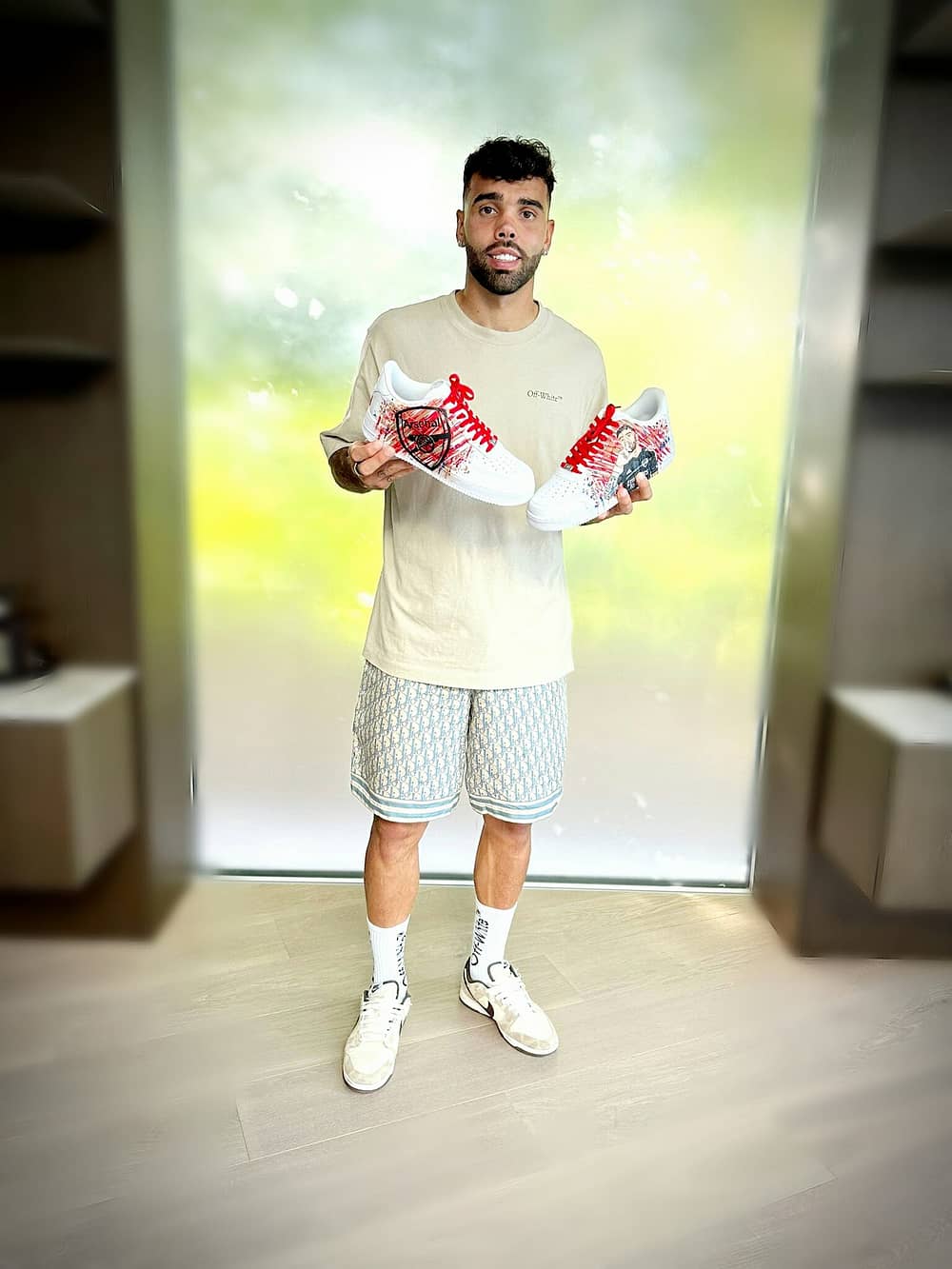 David Raya Arsenal FC Nike AF1 sneakers celebrity client holding his custom painted sneakers