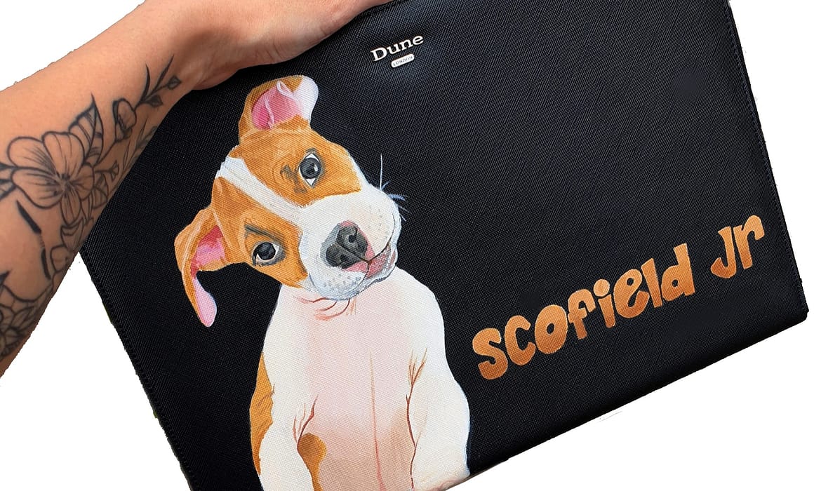 A pouch bag with hand painted art of a Pet dog puppy called Scofield Jr