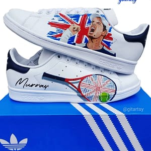 a realistic portrait of Andy Murray Tennis player with England flag and racket- hand painted on white Adidas Stan smith sneakers - in hand