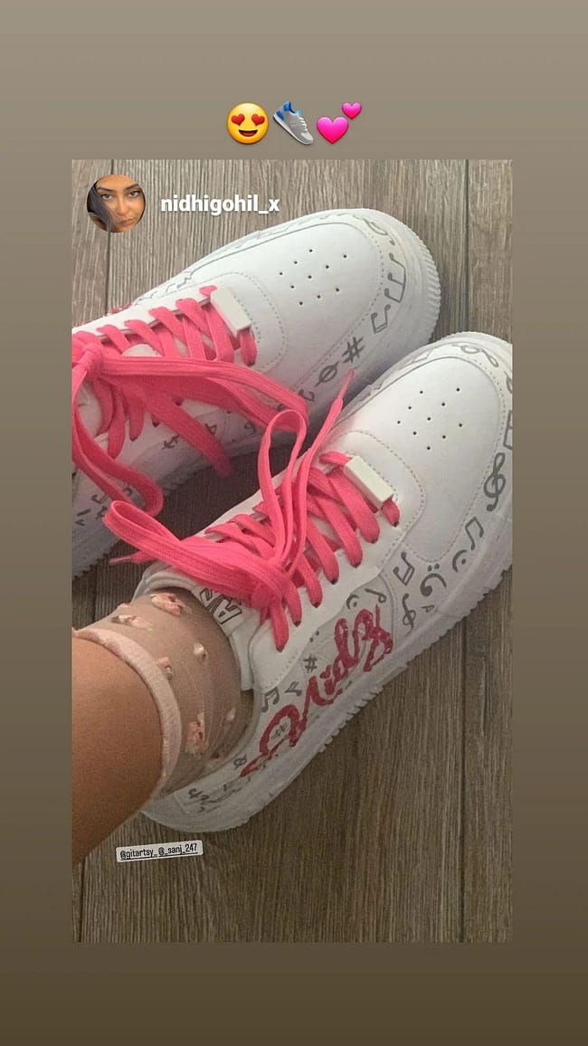 client photo wearing painted sneakers