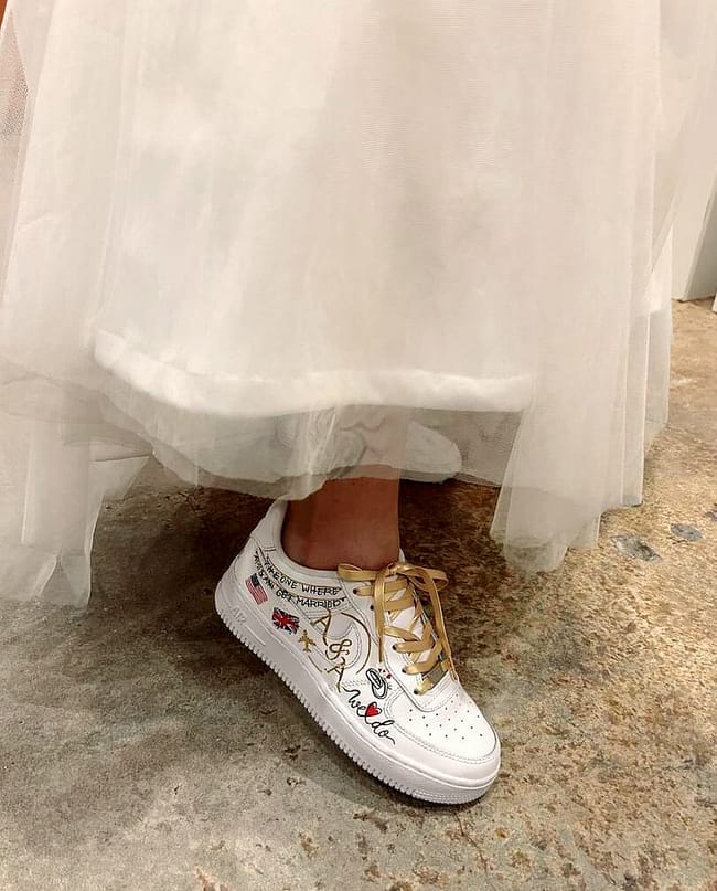Indian bride in white dress wearing hand painted custom bridal Nike AF1 sneakers